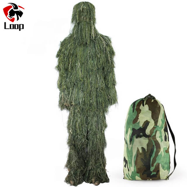 Tactical camouflage ghillie suit in field environment